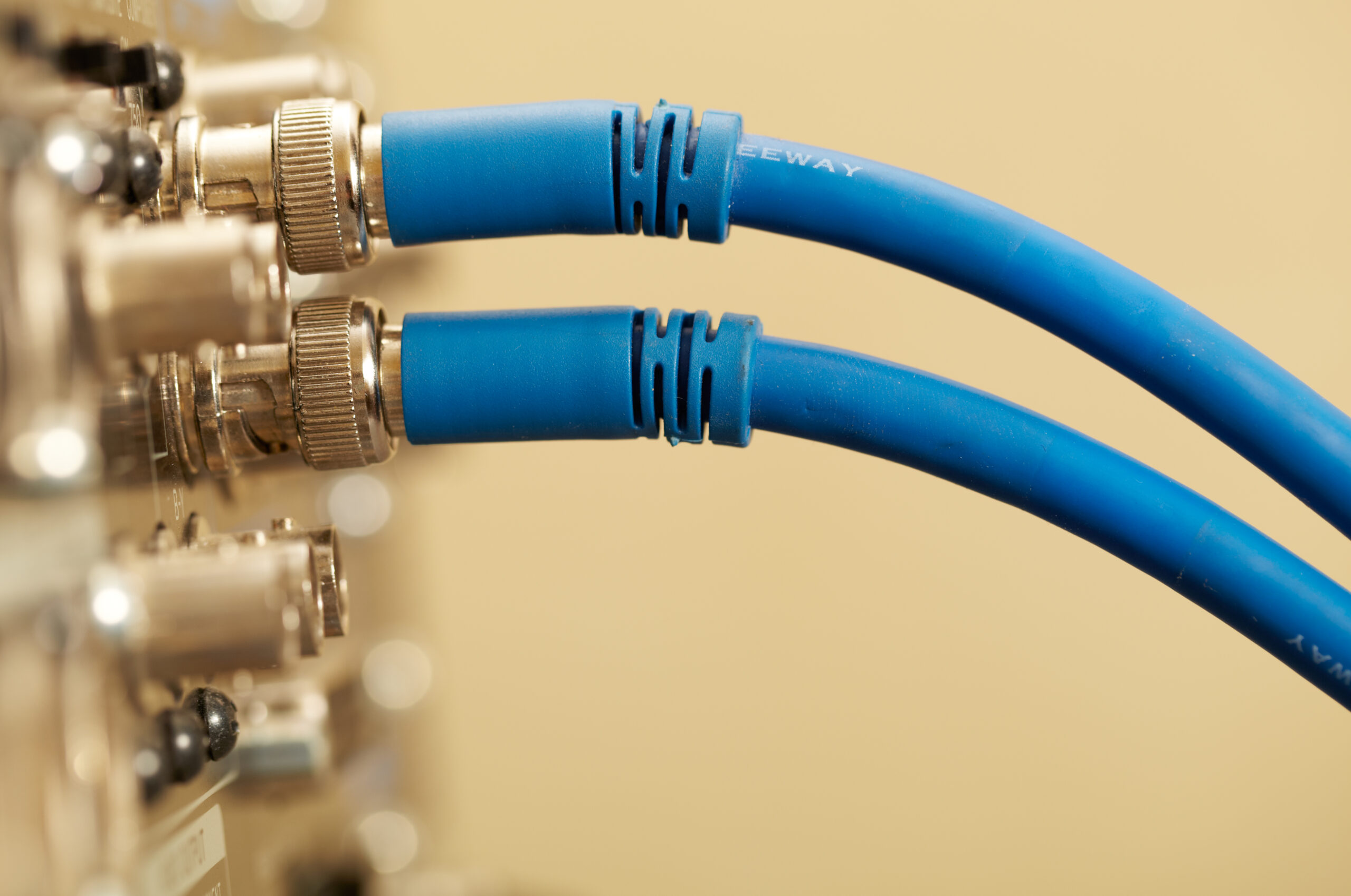 Macro shot of the 2 HD SDI-video cables and digital video connectors on the back of the professional vcr